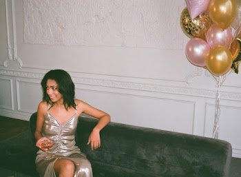 Woman Sitting on Sofa