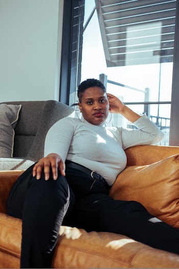 Woman Sitting on Sofa