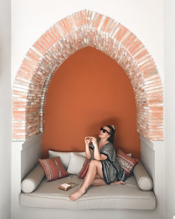 Woman Sitting on Sofa