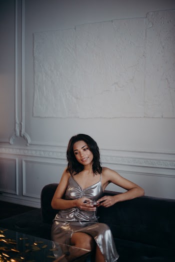 Woman Sitting on Sofa