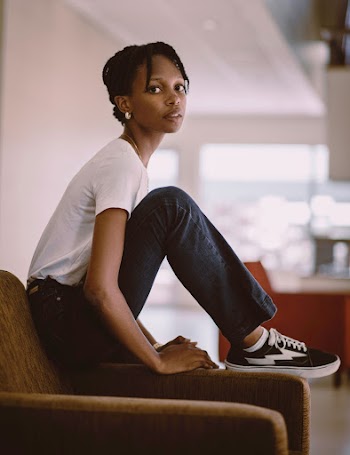 Woman Sitting on Sofa Chair Wearing White T-shirt