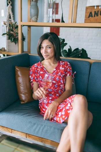 Woman Sitting on Sofa Holding Wine Glass