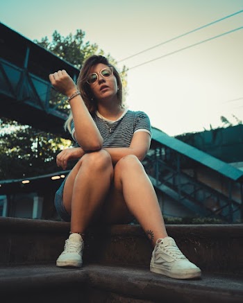 Woman Sitting on Stair