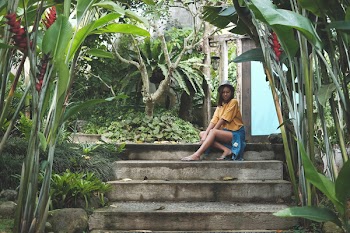 Woman Sitting on Stair Outdoors