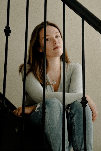 Woman Sitting on Stairs