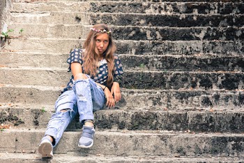 Woman Sitting on Stairs