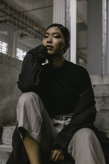 Woman Sitting on Stairs