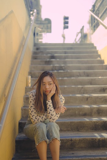 Woman Sitting On Stairs