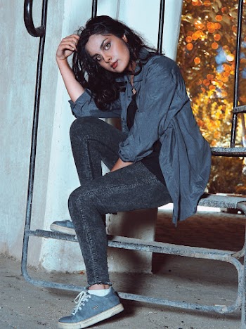 Woman Sitting on Stairs