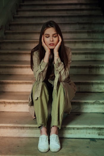 Woman Sitting on Stairs
