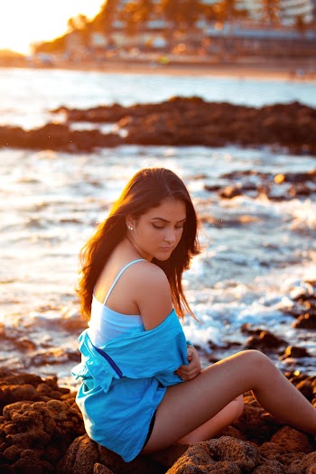 Woman Sitting on Stones