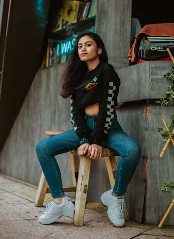 Woman Sitting on Stool