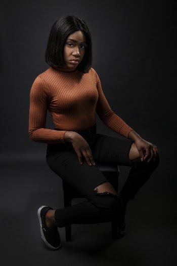 Woman Sitting On Stool