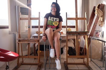 Woman Sitting on Stool