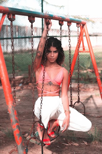Woman Sitting on Swing