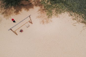 Woman Sitting on Swing