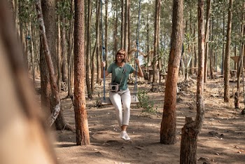 Woman Sitting On Swing