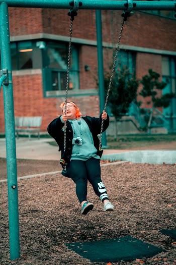 Woman Sitting on Swing