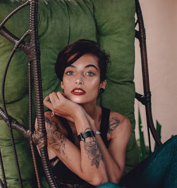 Woman Sitting on Swing Chair Holding Both Her Hands