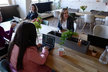 Woman Sitting on the Chair Using Laptop