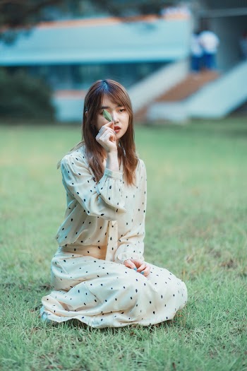 Woman Sitting on the Grass