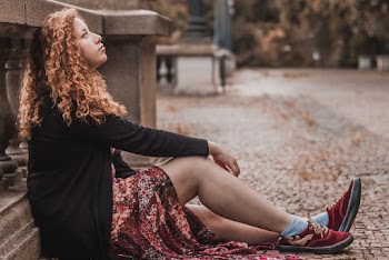 Woman Sitting On The Ground