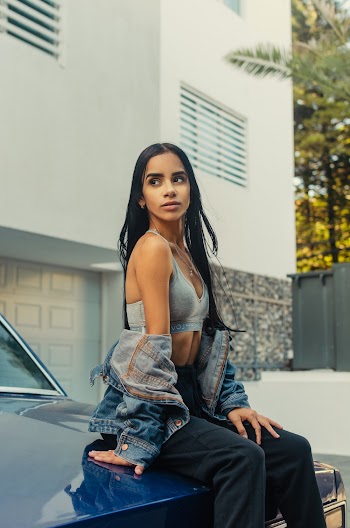Woman Sitting on Vehicle