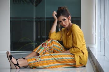 Woman Sitting On White Floor Tile