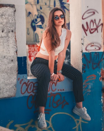 Woman Sitting on Window