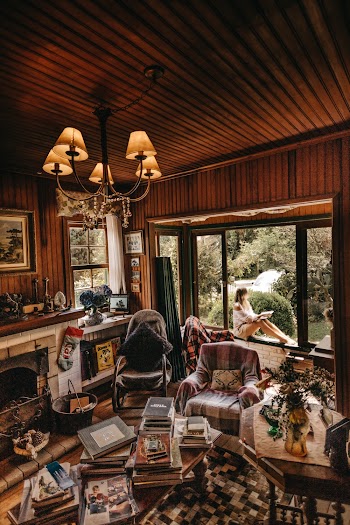 Woman Sitting On Window
