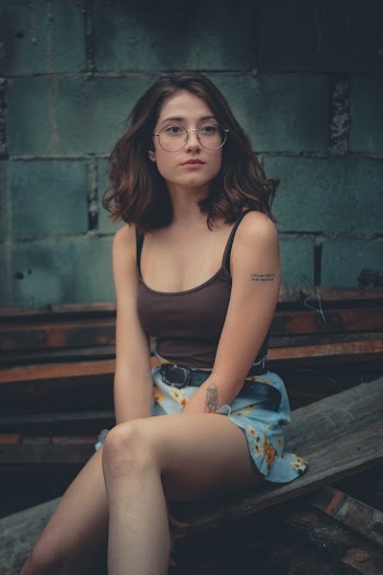 Woman Sitting On Wood Slab