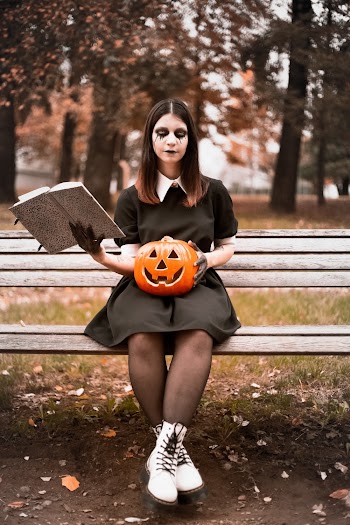 Woman Sitting on Wooden Bench
