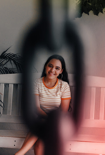 Woman Sitting on Wooden Bench
