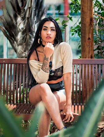 Woman Sitting on Wooden Bench