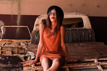 Woman Sitting on Wooden Pallet