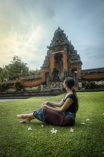 Woman Sitting on Yard