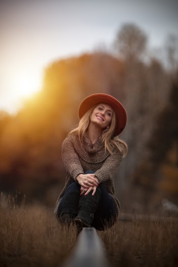 Woman Sitting Outdoors