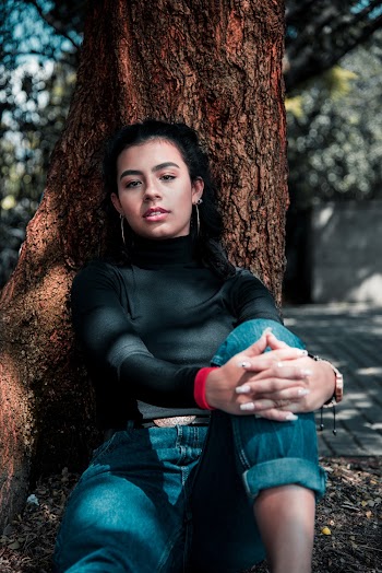 Woman Sitting Under Tree