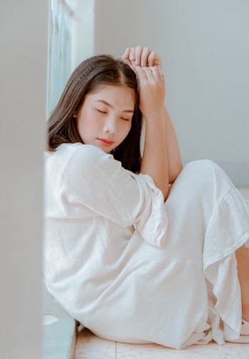 Woman Sitting Wearing White Dress