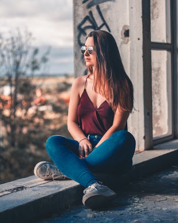 Woman Sitting With Legs Cross Staring on Right Side