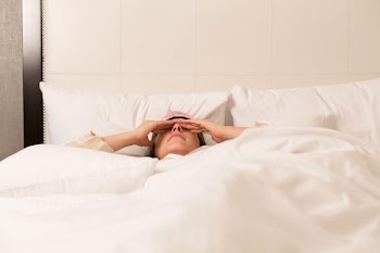 Woman Sleeping In Hotel
