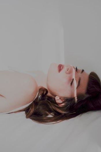 woman sleeping in white panel