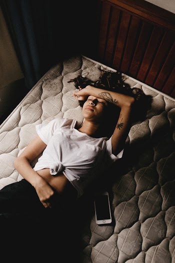 Woman Sleeping on the Bed