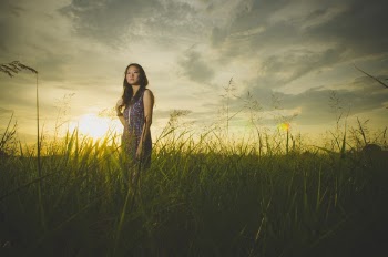 Woman Sleeveless Dress Standing On Green Grass Field