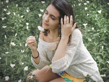 Woman Smelling Flower
