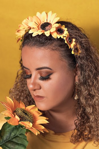 Woman Smelling Sunflower