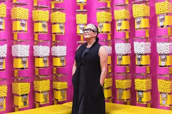 Woman Smiles In Candy Shop