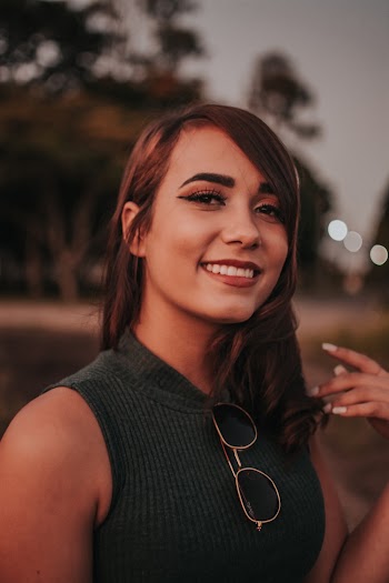 Woman Smiles Near Road