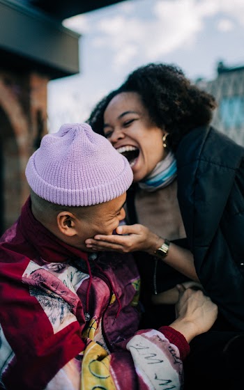 Woman Smiling Beside Man