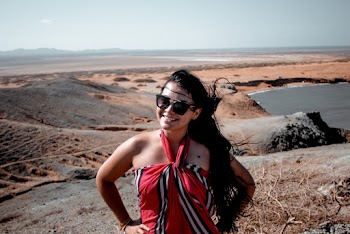Woman Smiling Standing on Hill